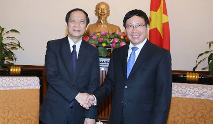 Phó Thủ tướng Phạm Bình Minh tiếp Thứ trưởng Bộ Ngoại giao Lào Alounkeo Kittikhoun - Ảnh: VGP/Hải Minh