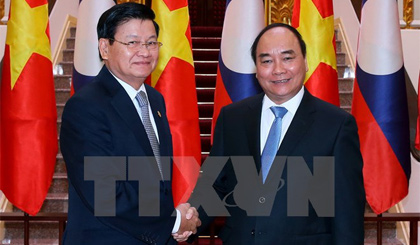 Thủ tướng Nguyễn Xuân Phúc đón, hội đàm với Thủ tướng Lào Thongloun Sisoulith. Ảnh: Thống Nhất/TTXVN