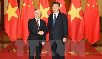 Tổng Bí thư, Chủ tịch nước Trung Quốc Tập Cận Bình đón Tổng Bí thư Nguyễn Phú Trọng. Ảnh: Trí Dũng/TTXVN