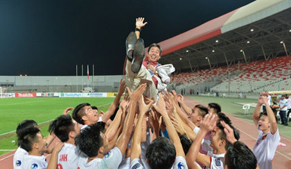 Coach Hoang Anh Tuan (centre) and his players have etched their names into Vietnam’s football history.
