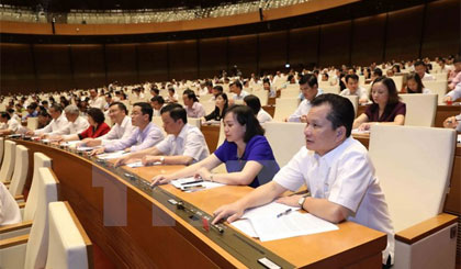 Quốc hội biểu quyết thông qua Luật quản lý ngoại thương. Ảnh: Phương Hoa/TTXVN