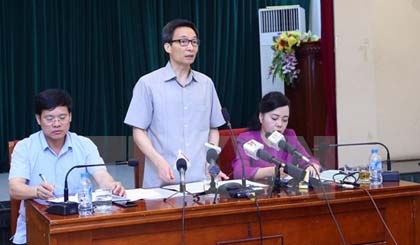 Deputy Prime Minister Vu Duc Dam speaking at the working session (Photo: VNA)