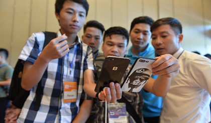 Users test the second-generation Bphone at a launch event on August 8.
