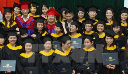 Graduates from University of Languages and International Studies under National University Hanoi at a graduation ceremony. ​(Source: VNA)