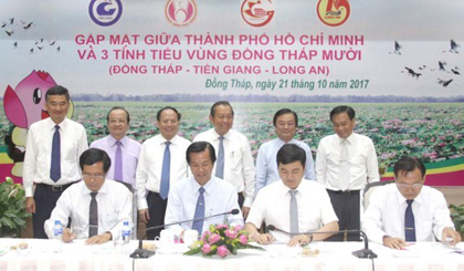 A meeting to economic cooperation and development between Dong Thap, Long An and Tien Giang with Ho Chi Minh City.