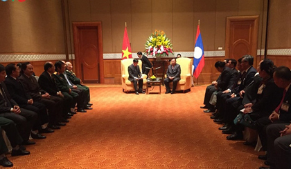  Lao Party General Secretary and President Bounnhang Vorachith meets with representatives of the Vietnam-Laos Friendship Association