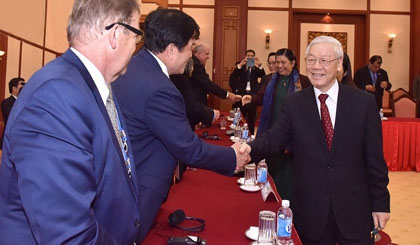 General Secretary Nguyen Phu Trong (right) greets international guests.