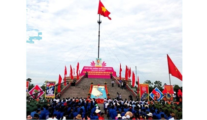 The flag-raising ceremony at Hien Luong Bridge
