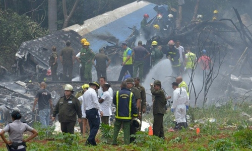 Fire crews and ambulances rushed to the scene of the crash. (Photo: AFP)