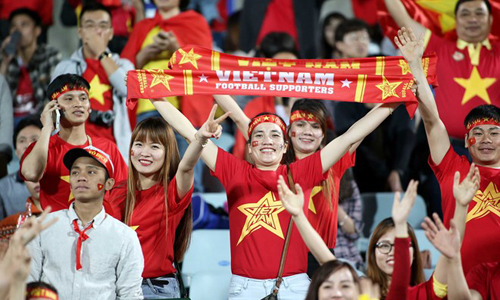 Vietnamese football supporters captured in a stadium (Photo: VNA)