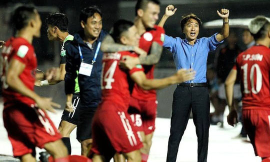 Manager Toshiya Miura celebrates after Ho Chi Minh City beat SHB Da Nang 4-2.