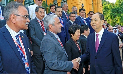 President Tran Dai Quang and the delegates. (Photo: VNA)