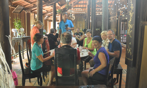 Foreign tourists visit the ancient house in Dong Hoa Hiep village, Cai Be district, Tien Giang province. Photo: HUU CHI