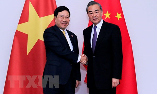 Deputy Prime Minister and Foreign Minister Pham Binh Minh (L) and Chinese State Councilor and Foreign Minister Wang Yi (Source: VNA)