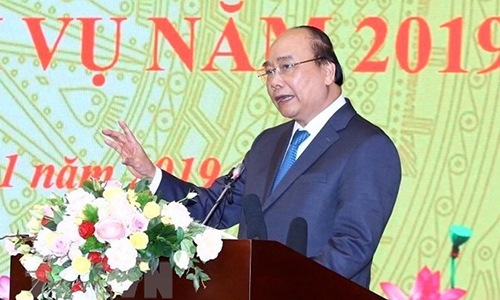 Prime Minister Nguyen Xuan Phuc addresses at the conference organised in Hanoi on January 15. (Photo: VNA)
