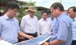 Chairman of the PPC Le Van Huong surveys the Binh Xuan bridge project