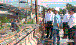 Chairman of the PPC Le Van Huong checks the basic construction works