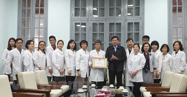 Các cá nhân và tập thể của Viện Vệ sinh dịch tễ trung ương được nhận bằng khen của Bộ Y tế. (Ảnh: PV/Vietnam+)