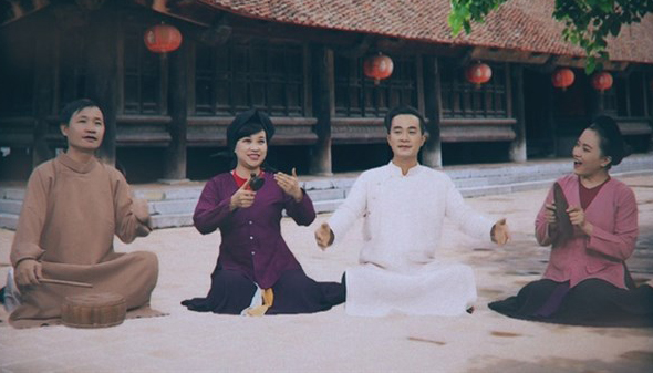 Artists of Xam Ha Thanh perform Tieu Diet Corona (Destroy Corona), a song encouraging the spirit of the citizens in the fight against the COVID-19 pandemic in the country. (Photo cut from the MV)
