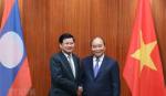 Thủ tướng Nguyễn Xuân Phúc hội đàm với Thủ tướng Thongloun Sisoulith