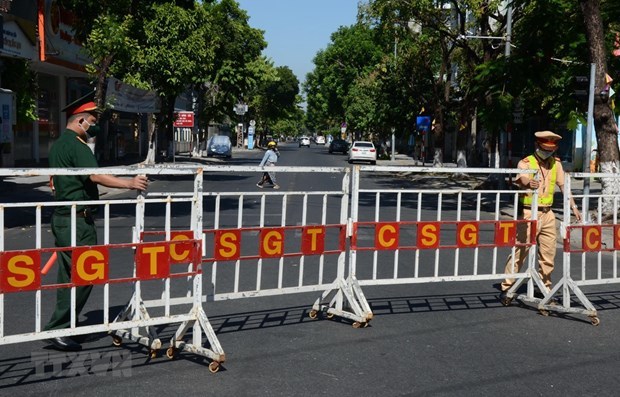 A street in Da Nang is blocked as the city began lockdown of COVID-19 hotspots on July 2819 cases reported in central Da Nang city.