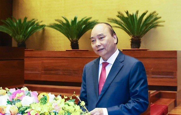 Prime Minister Nguyen Xuan Phuc presents the socio-economic development strategy for 2021-2030 and the orientations and tasks for 2021-2025 on March 28 (Photo: VNA).