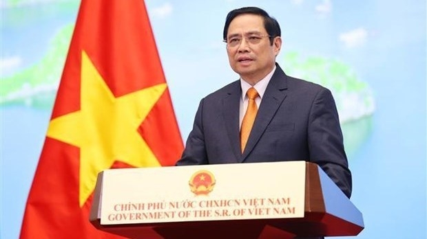 Prime Minister Pham Minh Chinh attends and delivers a speech at the 2021 Global Trade in Sevices Summit via viedeo (Photo: VNA)