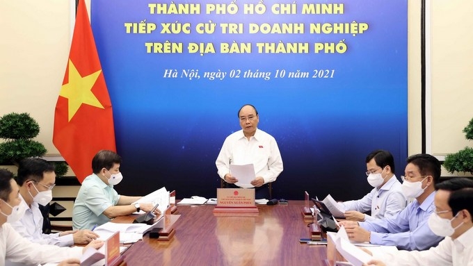 President Nguyen Xuan Phuc speaks at the meeting. (Photo: VNA).
