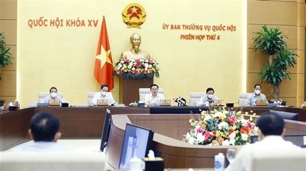 NA Chairman Vuong Dinh Hue (centre) speaks at the event. (Source: VNA).