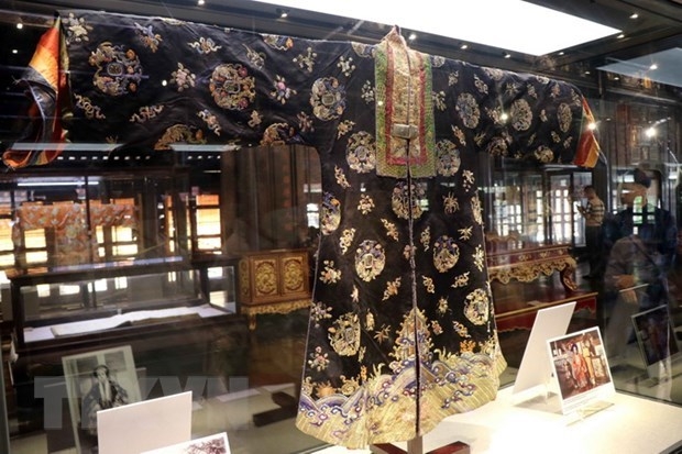 The silk dress dating back to the Nguyen dynasty is on display (Photo: VNA).