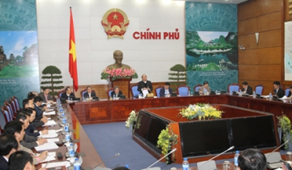 Deputy PM Nguyen Xuan Phuc holds working session with the Ministry of Justice on administrative procedure reform on December 25. (Image credit: VGP)