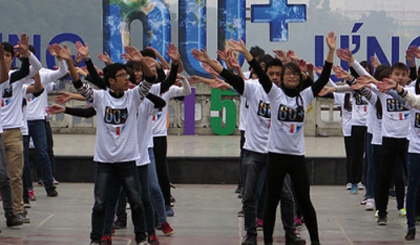 Young people dance at an event to launch Earth Hour in Hanoi.