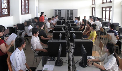 Students being instructed on how to complete the computerised test before the official test time begins.