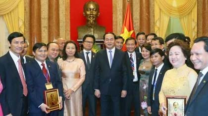 President Tran Dai Quang and businesspeople