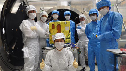 Vietnamese and Japanese experts with MicroDragon satellite.