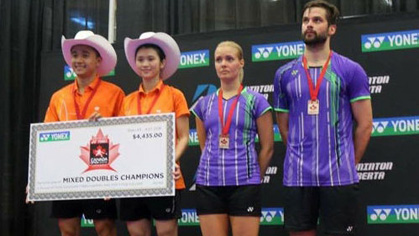 Do Tuan Duc and Pham Nhu Thao (in orange) win the mixed doubles event at the Yonex Canada Open badminton tournament on July 3.