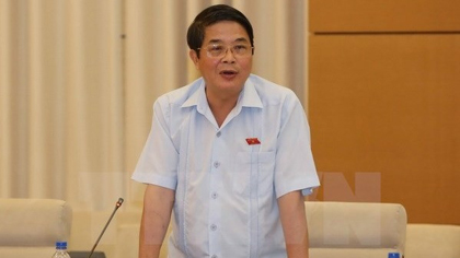 Chairman of the NA's Committee for Financial and Budgetary Affairs Nguyen Duc Hai speaks at the session. (Photo: VNA)