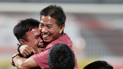 Coach Hoang Anh Tuan (centre) and his players have etched their names into Vietnam’s football history. 