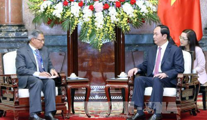 Peresident Tran Dai Quang meets with Malaysian Minister of International Trade and Industry Datuk Seri Mustapa Mohamed. (Photo: VNA)