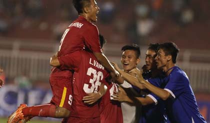 U-21 Vietnam players celebrate their opener against U-21 Myanmar on December 18.