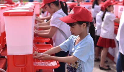 Pupils wash their hands in response to the Global Han