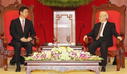  Vietnamese Party General Secretary Nguyen Phu Trong (R) receives Song Tao (L), special envoy of General Secretary of the Communist Party of China Xi Jinping, in Hanoi on November 1. (Credit: VNA)