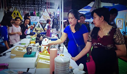 Local residents explore products from Japan on the opening day of the culture and trade exchange.