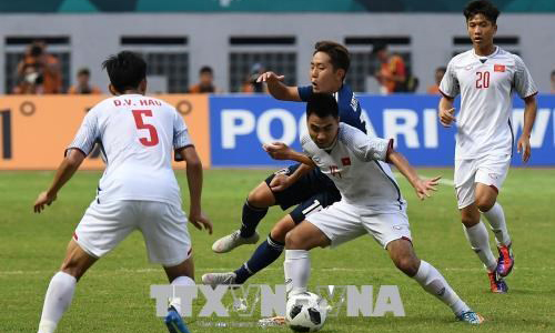  Vietnamese football players in their match with Japan at the ASIAD 2018 on August 19 (Photo: VNA)