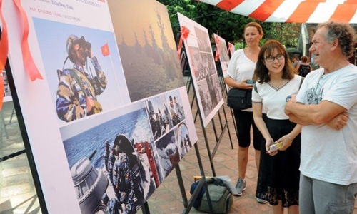 Visitors at the photo exhibition. 