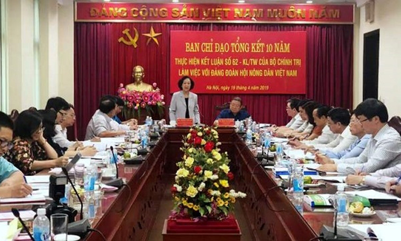 Politburo member and Head of the Party Central Committee’s Commission for Mass Mobilisation, Truong Thi Mai (standing), speaks during a meeting with the Central Committee of the Vietnam Farmers' Association in Hanoi on April 19.