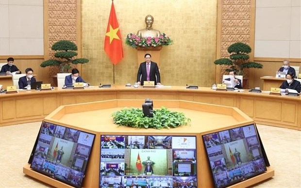 Prime Minister Pham Minh Chinh speaks at the meeting. (Photo: VNA).