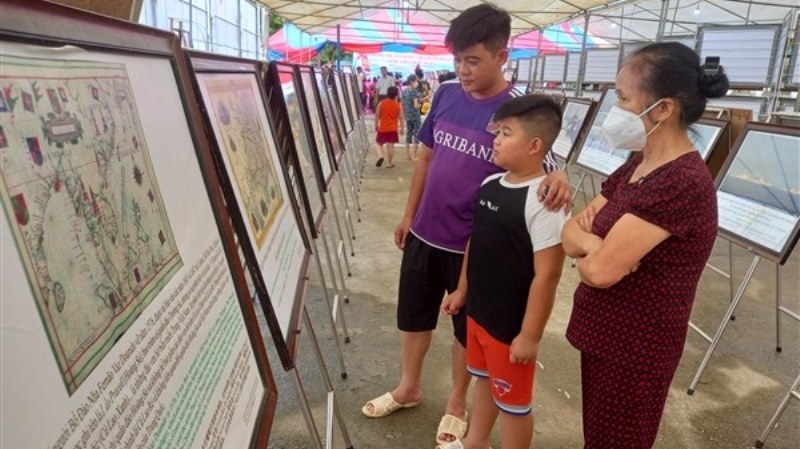 Local residents visit the exhibition.