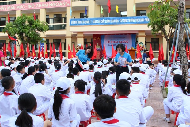 Tuyên truyền về việc tham gia bảo hiểm y tế cho học sinh/sinh viên. (Ảnh: PV/Vietnam+)