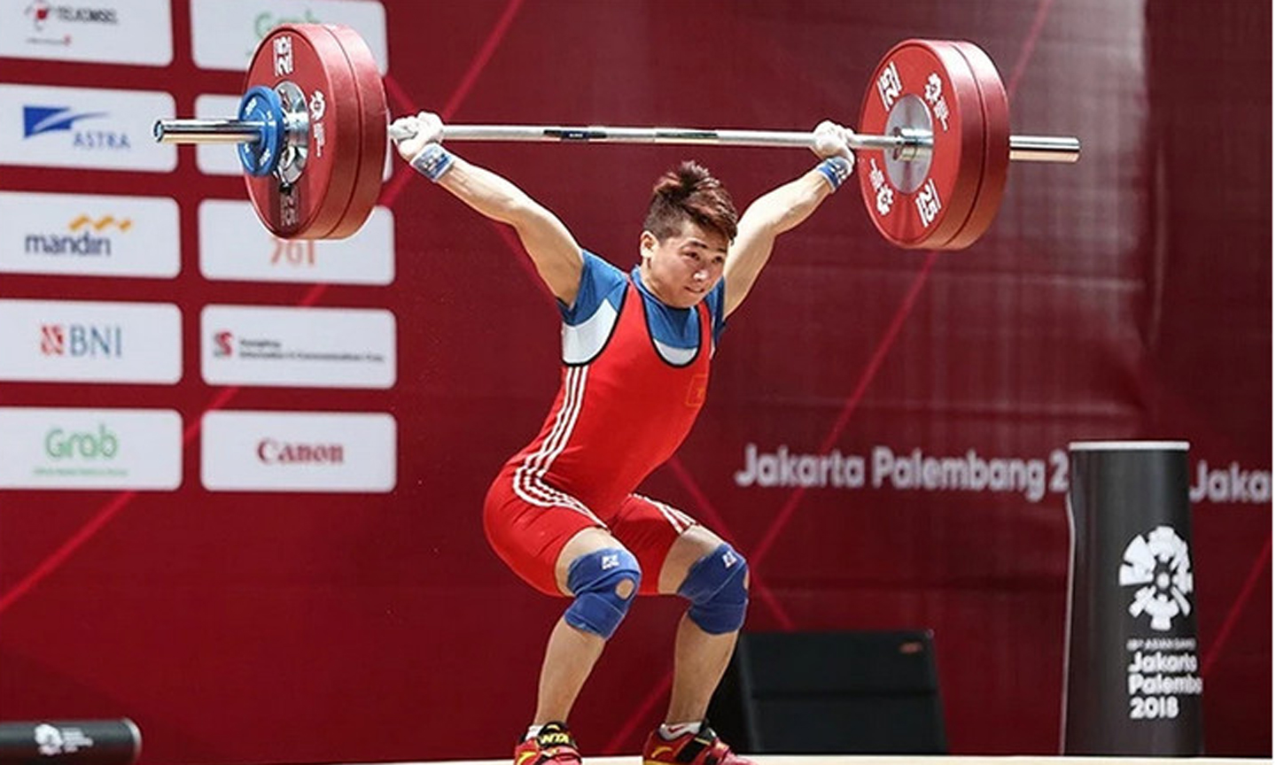 Vận động viên cử tạ Trịnh Văn Vinh được kỳ vọng giành huy chương tại Olympic Paris 2024. (Ảnh DT)